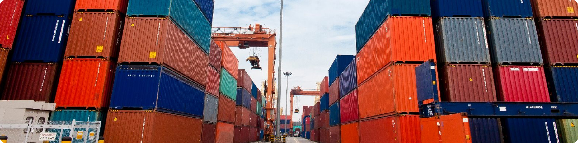 Stacked dry cargo containers at port
